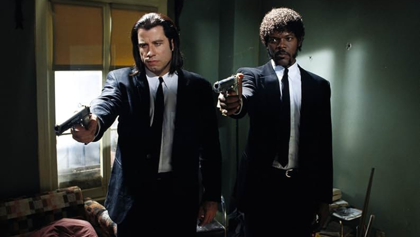 Image of Samuel L. Jackson and John Travolta brandishing their guns, ready to fire in Pulp Fiction