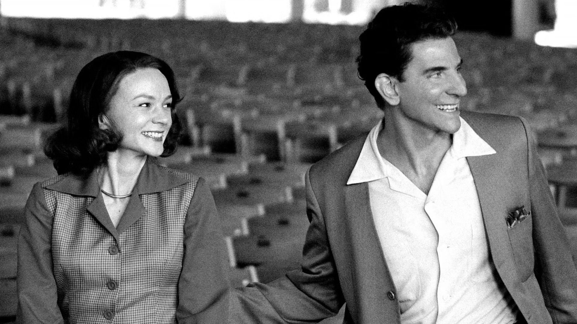 A greyscale image of Carey Mulligan as Felicia Montealegre standing with Bradley Cooper as Leonard Bernstein in 'Maestro,' 7 Great Oscar Nominated Scripts You Should Read