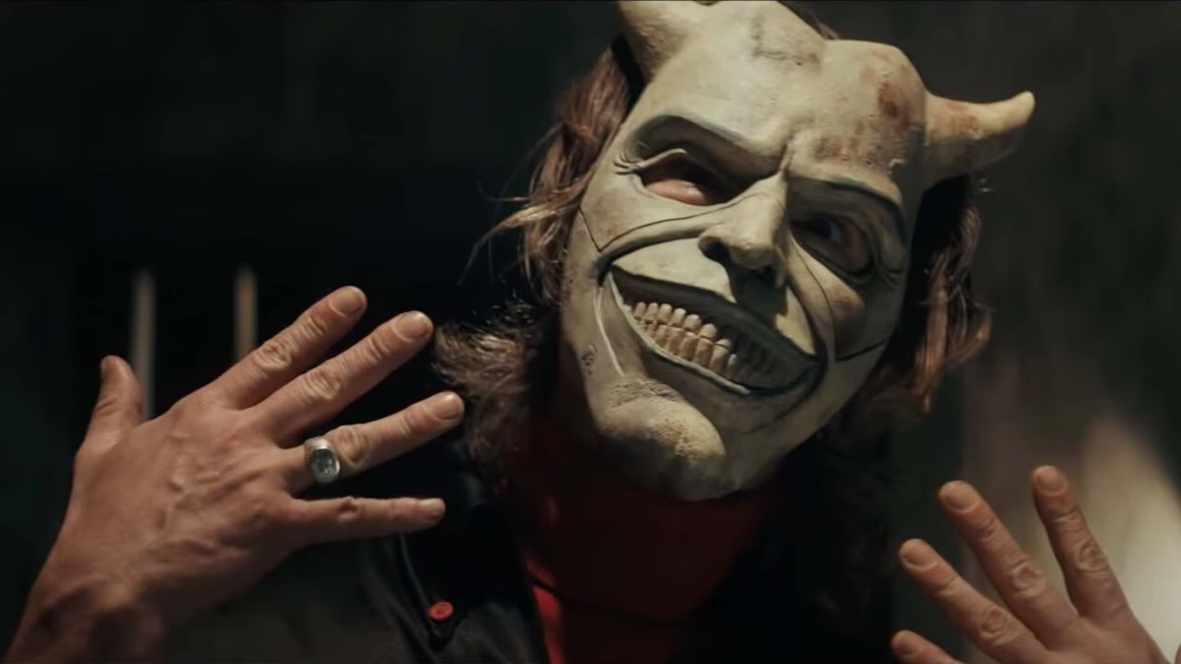 The Grabber (Ethan Hawke) posing with his mask on in 'The Black Phone' (2022)