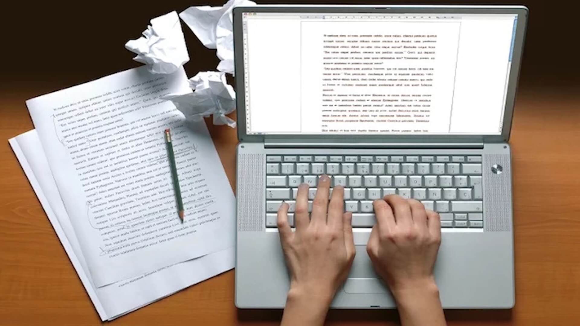 Writing on a laptop; The Differences Between a Rewrite and a Polish